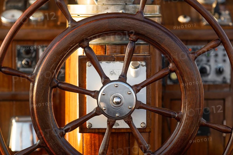 Detail of a teak steering wheel on a sailing ship, Aeolian or Aeolian Islands, Sicily, Southern Italy, Italy