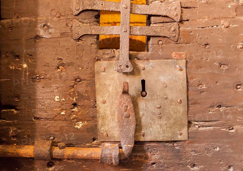 Castle of a historic wooden door of a prison cell in the Ducal Palace, Venice, Veneto, Italy