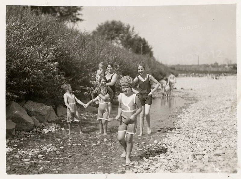 Bathing, swimwear, leisure, summer, swimming, stream, children playing in the shallow water of a rocky riverbank, around 1920