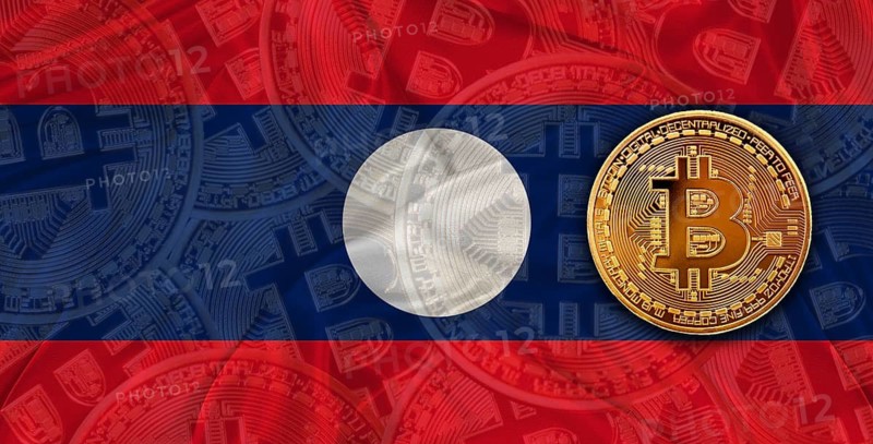 Investors in Blockchain Technology with Laos flag background. Bitcoin cryptocurrency with Laotian flag