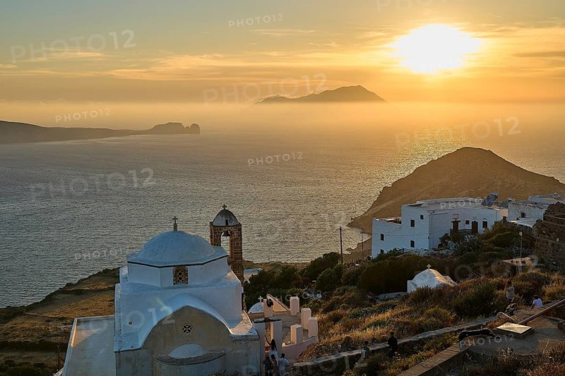 Panagia of Thalassitra Church, Panagia Thalassitra, Idyllic sunset over the sea with white church in the foreground and islands on the horizon, Plaka, main town on Milos, island of Milos, volcanic island, Cyclades, Greek islands, Greece