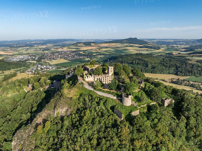 Aerial view of the Hohentwiel volcanic cone with Germany's largest fortress ruin, in the morning sun, a tourist attraction in the Lake Constance region, on the Hohenstoffeln horizon, Hegau, Konstanz district, Baden-Württemberg, Germany