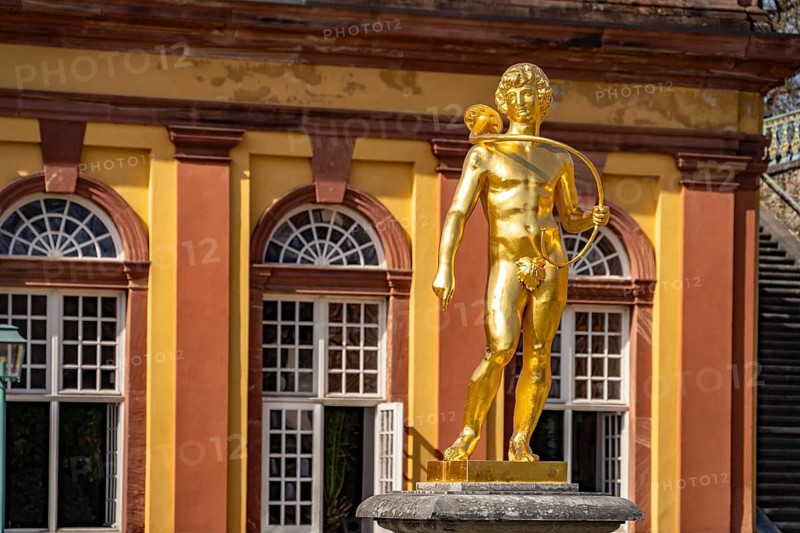 Golden statue of the luhrenblower at the orangery of Weilburg Castle, Hesse, Germany