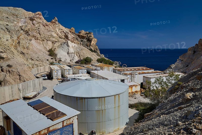 Seawater desalination plant, desalination plant on the coast surrounded by rocky landscape under clear blue sky, volcanic island, island, Milos, Cyclades, Greek Islands, Greece