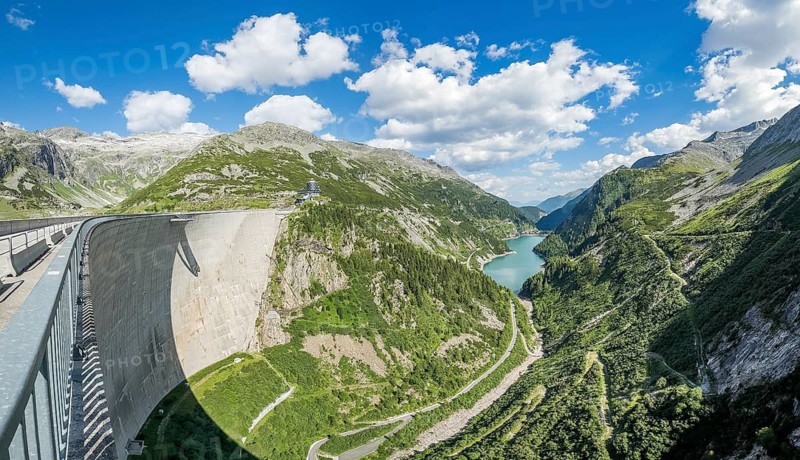 Panoramic view from the air side facing away from the water with Airwalk viewing platform at a 200-meter high Kölnbrein dam, in the middle back reservoir Galgenbichl Speicher reservoir, Malta Valley, Carinthia, Austria