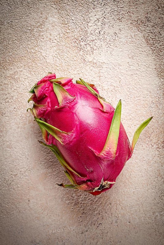 Dragon fruit, Pitahaya, one piece, top view, rustic style, beige background