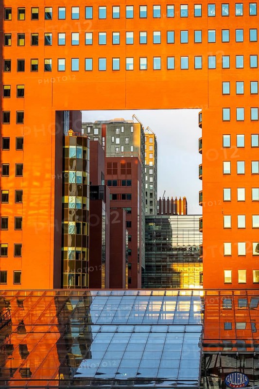 View through the building of the public prosecutor's office, red, on Wilhelminaplein, on the Nieuwe Maas, Kop van Zuid, Rotterdam, Netherlands