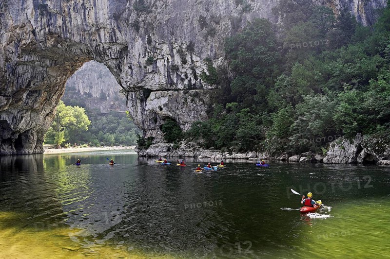 Canoes on the Ardèche river, above the Pont d'Arc rock gate, Ardèche Gorge, Gorges de l'Ardèche, Vallon-Pont-d'Arc, Rhône-Alpes, France