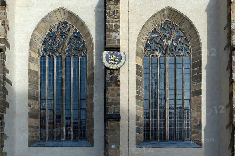 Sundial between Gothic church windows of St. Peter's Cathedral, built 1213-1221, Bautzen, Upper Lusatia, Saxony, Germany