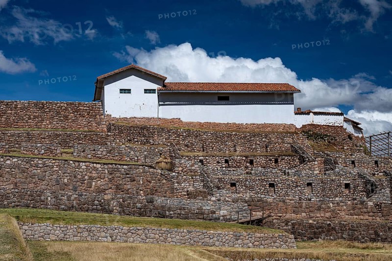 Agricultural terraces, Inca walls and colonial village church in Cinchero, archaeological site, Urubamba Valley, Cusco region, southern Peru, Peru, South America