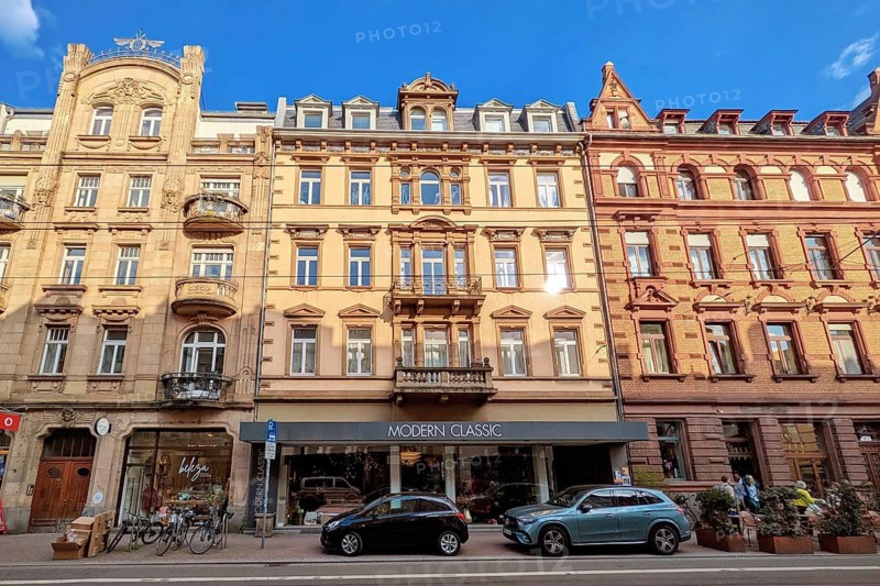 Heidelberg, Germany - 19 March 2026: Beautiful old historic buildings at Brückenstraße in Heidelberg illuminated by warm evening sun
