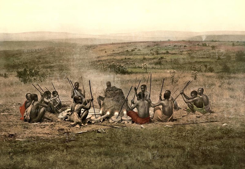 Mpororo smelter on the Kilimanjaro steppe from 1911. Traditional method of African iron extraction in a dome-shaped racing furnace, melting furnace. The men use long blowpipes to conduct oxygen into the furnace to generate the high temperatures required for smelting iron ore, Africa, school picture, illustration, reproduction from a 19th century model. School picture, mural, authentic, file restored for optimal use, exact date of original unknown, historical