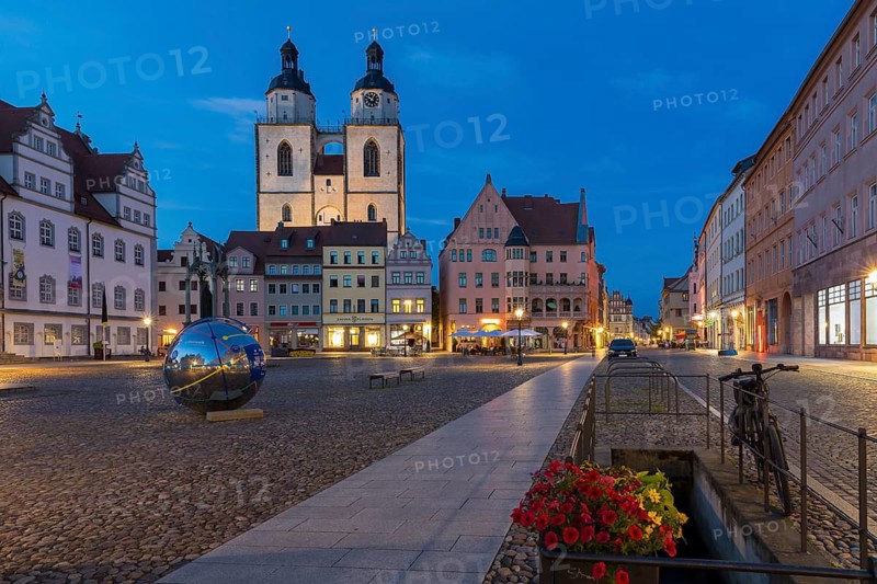 Atmospheric night view of market square with city church and old town hall, Luther city Wittenberg, Saxony-Anhalt, Germany