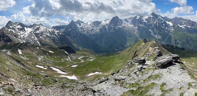 Panoramic view of small switchbacks in the middle of the picture North ramp North driveway of Grossglockner High Alpine Road Grossglockner High Alpine Road, top left above it road loop on Mittertörl, in the background eastern part of the Grossglockner Massif, Fusch, State of Salzburg, Austria