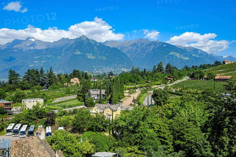 View from Trauttmansdorff Castle, home of the South Tyrolean State Museum of Tourism, of the surrounding alpine landscape of Merano, Burggrafenamt, South Tyrol, Italy