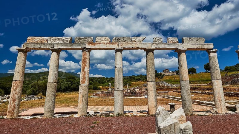 Stoa of the market, ancient remains of columns under blue sky with surrounding nature, ancient site, archaeological site, Messene, Messini, Messinia, southwest of the Peloponnese, odyssey, Odyssey, Odysseus, Ulysses, film, filming location, Matt Damon, Peloponnese, peninsula, Greece