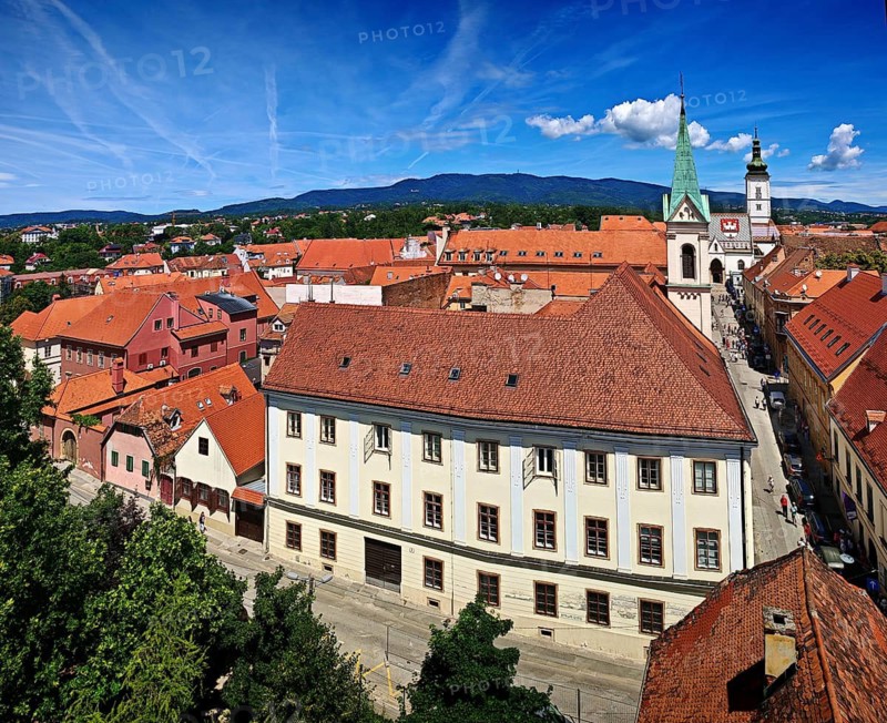 View of an old town with church, tiled roofs and a blue sky in the background, Zagreb, Croatia