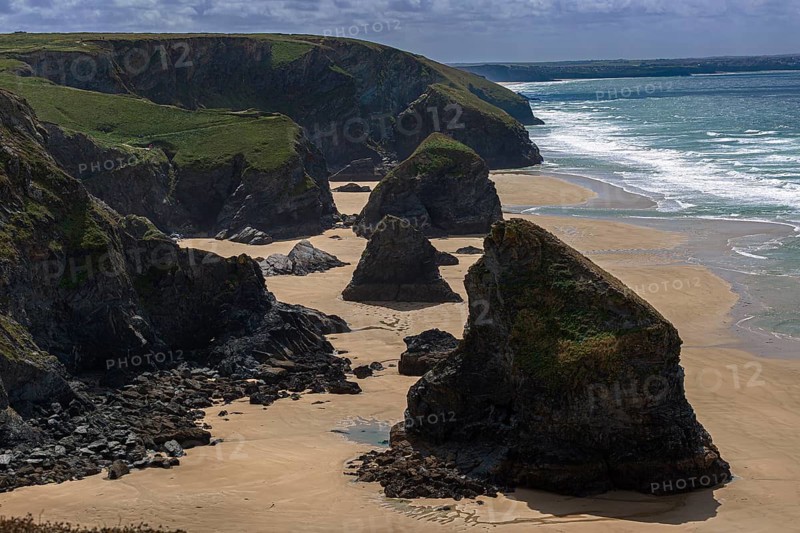 Picturesque rock formations at Bedruthan Steps at low tide on the coast of Cornwall, England, Great Britain