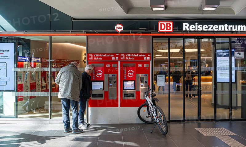 Everyday scenes, travelers and railway employees as well as the interior design, signs, signposts and the DB travel center, in and at Berlin Central Station, Germany