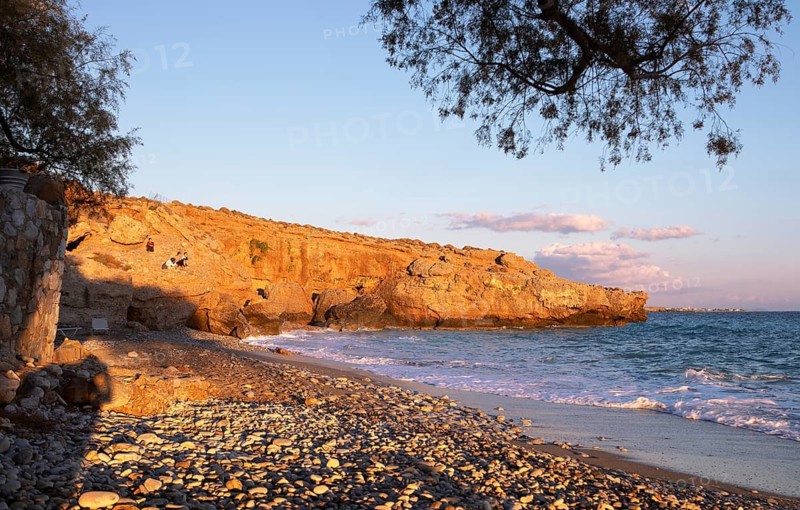 Orange rocks on Koutelo Beach or beach at sunset, Vouvas near Chóra Sfakion, Chania Regional Unit, Sfakia Municipality, Crete, Greece