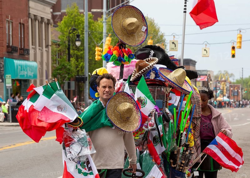 Detroit, Michigan USA - 3 May 2026 - The annual Cinco de Mayo parade in southwest Detroit, a heavily Mexican-American community. A vendor sells flags, hats, and other items along the parade route