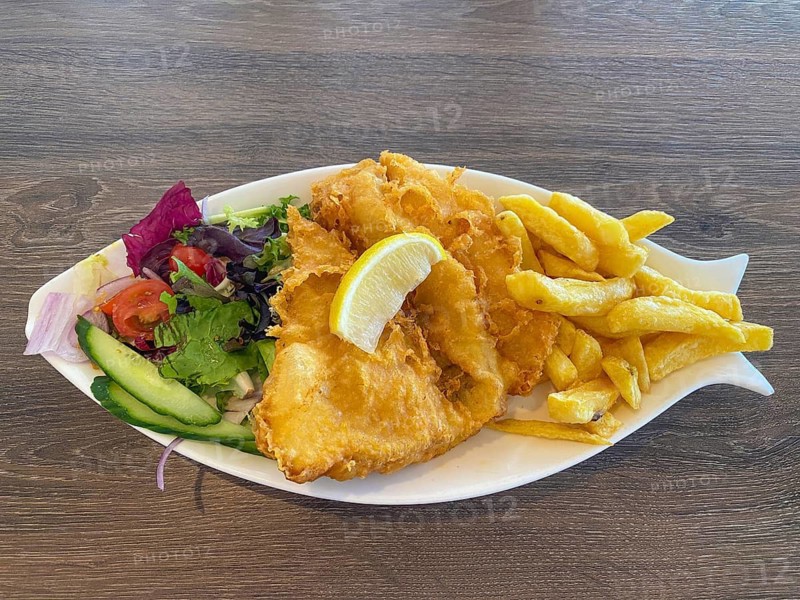 Fish and chips, fried fish in batter, french fries, pea puree, lemon, salad, on a plate, food, London, Great Britain, Great Britain
