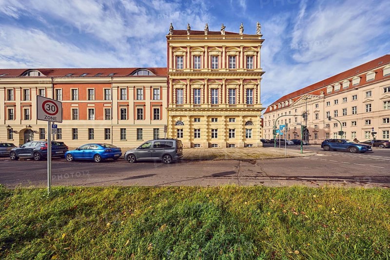 Residential building, historic town house, architect Georg Christian Unger, corner building, general architecture, facade with windows, central island, street, zone 30 sign, parking strip with cars, lawn, blue sky, cumulus clouds, cirrus clouds, intersection Breite Straße with Dortustraße, Potsdam, state capital, district-free city, Brandenburg, Germany