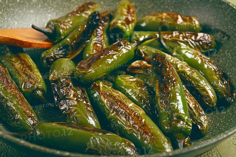 Fried padron pepper, in a frying pan, with olive oil, and sea salt, homemade, no people