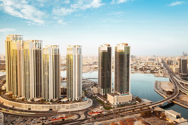 Abu Dhabi, UAE - 25th april, 2025: Aerial panorama luxury real estate property apartment buildings with cityscape view. Business hubs, real estate growth, futuristic urban development in Middle East