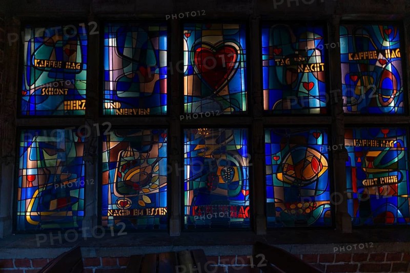 Stained glass window by Kaffee Hag, historic Böttcherstraße in the old town of the Hanseatic City of Bremen from the 1920s, example of clinker expressionist architecture, brick architecture, saving nerves, health, eating, drinking, advertising, popular tourist destination