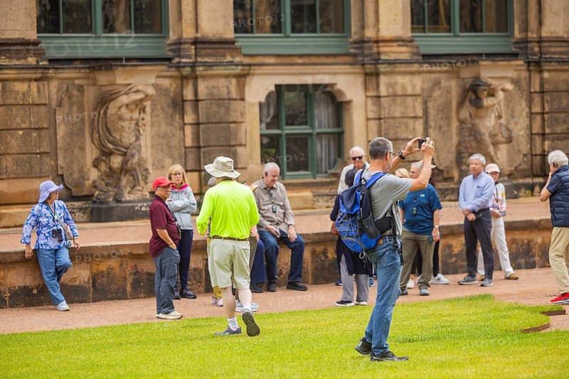 The Zwinger is one of Dresden's most important sights and is regularly stormed by crowds of tourists, who also slide across the laboriously maintained lawns without inhibition, Dresden, Saxony, Germany