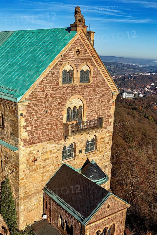 Detailed view of the castle with several windows and balconies, surrounded by countryside, The Wartburg near Eisenach in Thuringia