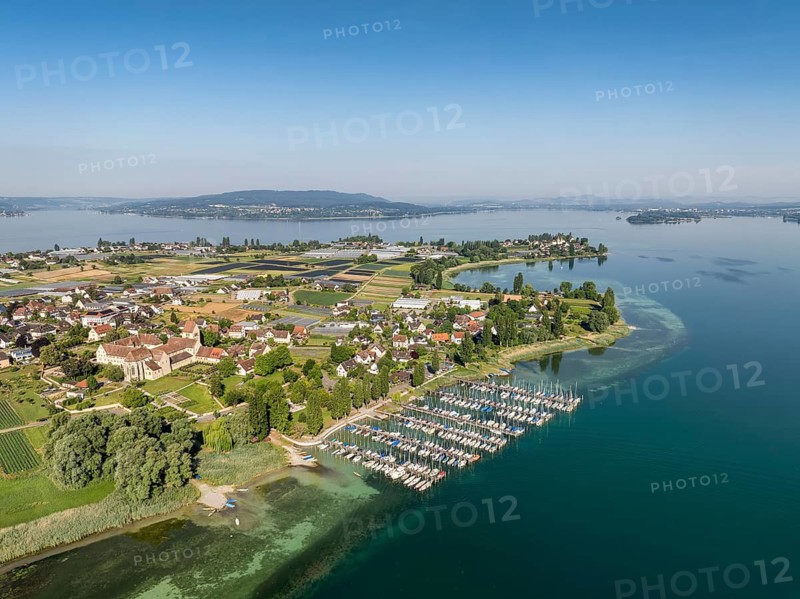 Aerial view of the island of Reichenau, in western Lake Constance, Untersee, with the marina, pleasure boat harbour Herrenbruck, on the left the cathedral of St. Maria and Markus and the Reichenau monastery, former Benedictine abbey in the district of Mittelzell, on the horizon the Höri peninsula, near Radolfzell, district of Konstanz, Baden-Württemberg, Germany