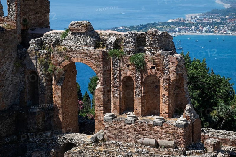 View of ruins of an ancient theatre and the Mediterranean Sea, Taormina, Sicily, Italy