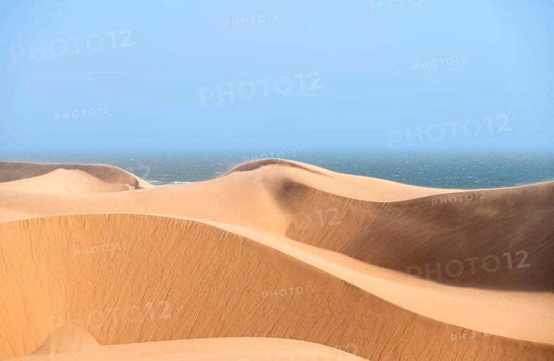 Sand dunes and sea, dune sea, impressive desert landscape, Sandwich Harbour, Namib Naukluft Park, Namibia