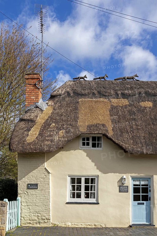 Animal wire figures on roof, thatched house, Bretforton, The Cotswolds, England, Great Britain