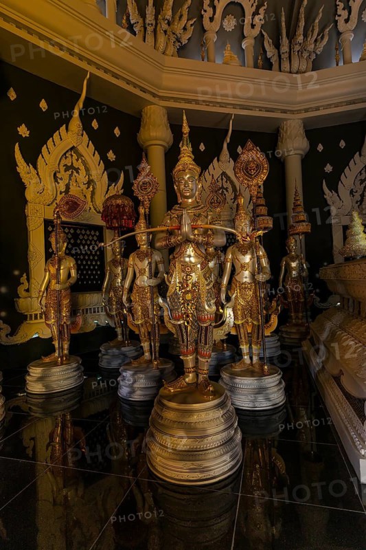 Figures as heavenly beings and temple guards in the public prayer hall in the Buddhist temple complex Wat Phra That Don Phra Chan, near Lampang, Lampang Province, Thailand
