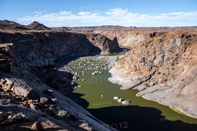 River bed and dump on the Orange River, Augrabies Falls National Park, Northern Cape, South Africa