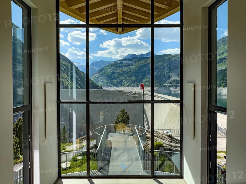 View through panoramic window in stairwell connecting parking lot to dam at Kölnbreinsperrre dam, Malta, Carinthia, Austria