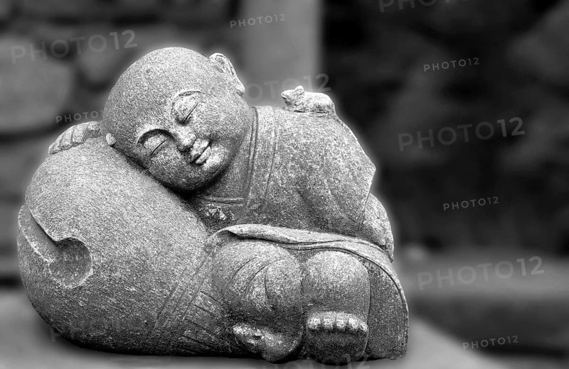 Smiling Buddha statue in Madeira, Portugal