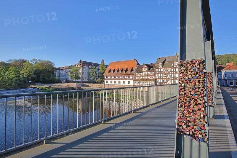 Landgrave's castle built in 1470 on the banks of the Fulda river with half-timbered houses, steel girders of the Old Fulda Bridge with love castles, Renaissance, Rotenburg an der Fulda, Hesse, Germany
