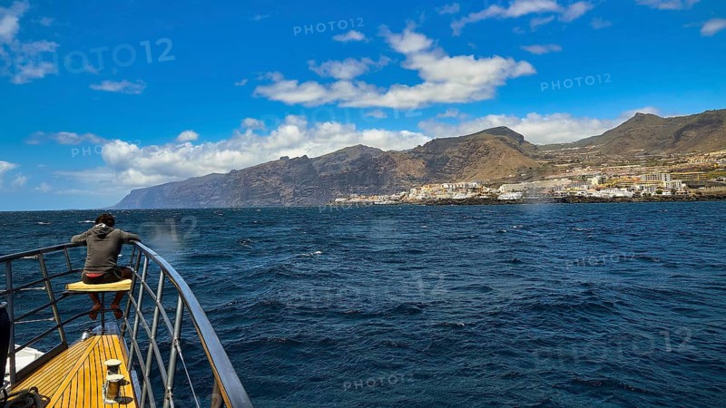 Los Gigantes, A boy enjoying the view of the sea and the mountain landscape from the ship, whale watching boat tour, whale watching, dolphins, west coast, Tenerife, Canary Islands, Spain