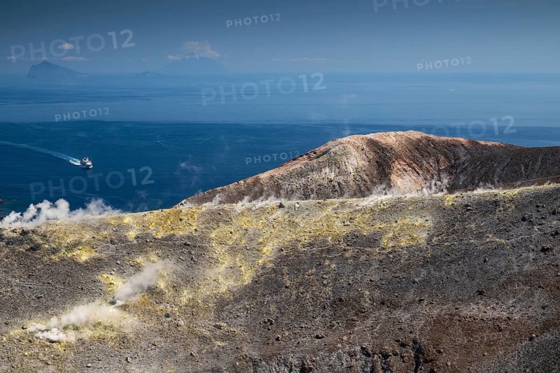 Ferry, crater rim, sulfur vapors rise, in the background Panarea and Stromboli volcano, Vulcano, Aeolian or Aeolian Islands, Sicily, southern Italy, Italy