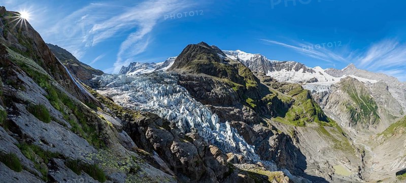 Mountain panorama, picturesque high alpine mountain landscape with Lower Arctic Sea glacier and Grindelwald-Fiescherfirn glacier, sun star, hiking to Schreckhornhütte, Bernese Oberland, Switzerland