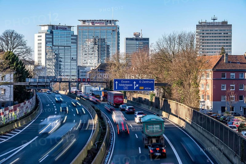 The A40 motorway, Ruhrschnellweg, in Essen, city skyline, Evonik office building, traffic jam in the westbound lane, Duisburg, slow traffic, North Rhine-Westphalia, Germany