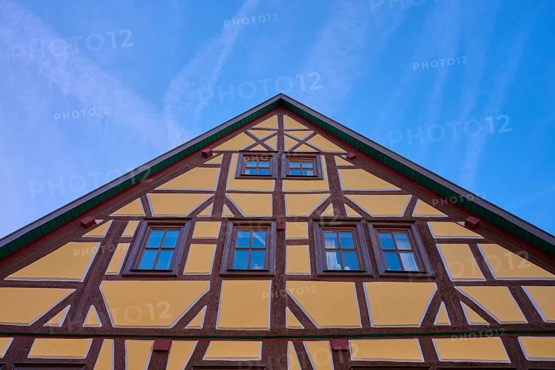 Traditional half-timbered house under clear blue sky, Lohr am Main, Schneewittchenstadt, Main-Spessart district, Mainfranken, Lower Franconia, Bavaria, Germany