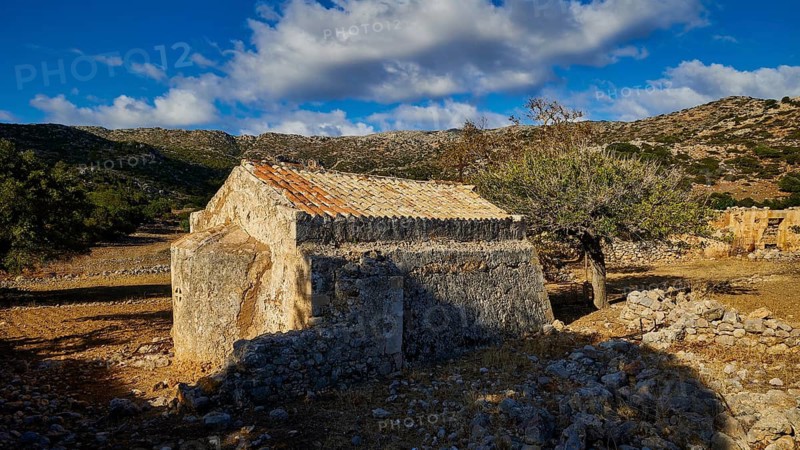 Agios Georgios Monastery and Church, Small old stone building with roof surrounded by rocks and trees in a rural area, Rodopou Peninsula, Rodopou, West Crete, Greek Islands, Greece