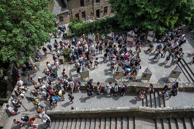 Mass tourism in the historic alleys and squares of the rocky island, monastery island of Le Mont Saint Michel, tourist attraction, UNESCO World Heritage Site, Pontorson, Manche department, Normandy, France