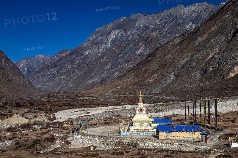 Buddhist stupa, including choirs with prayer flags, Tsum Valley, Himalayas, Nepal