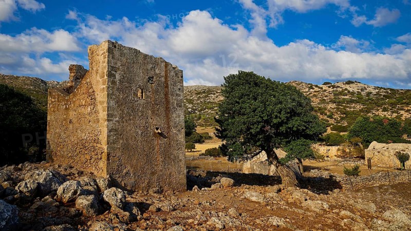 Agios Georgios monastery and church, stone ruin with a tree in a hilly, rocky landscape under a blue sky, Rodopou peninsula, Rodopou, West Crete, Greek Islands, Greece